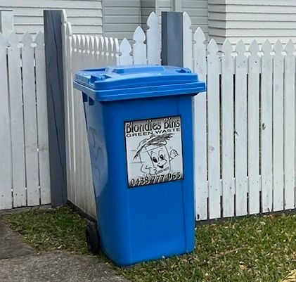 Blondies Bin garden bin by white fence Blondies Bin garden bin by white fence